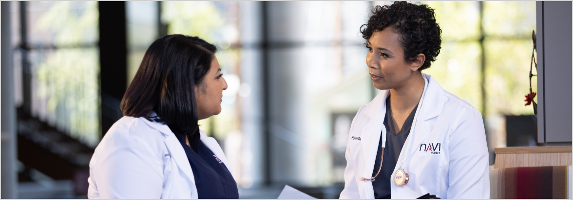 Two doctors talking to each other